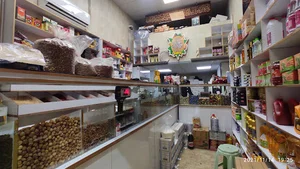 خواربارفروشی حاج احمد مالک اژدری و پسران